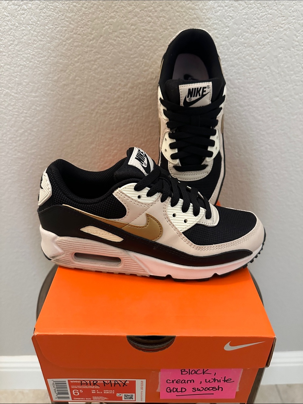 Nike Black Cream White Sneakers with Gold Swoosh